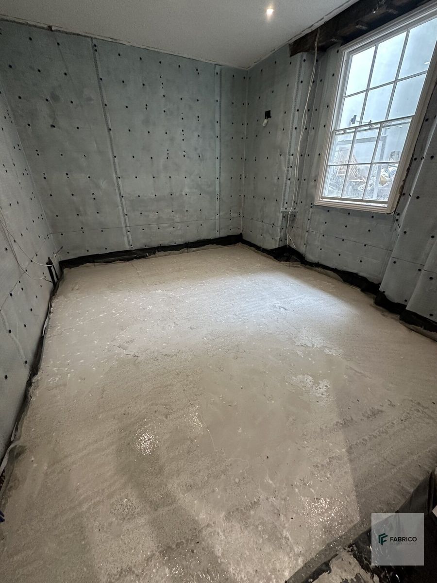Basement room — membrane and concrete floor with window
